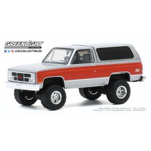1/64 GMC Jimmy (Lifted) 1984 white with orange